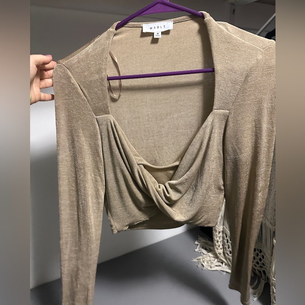 Size medium cropped champagne color shirt! Never worn